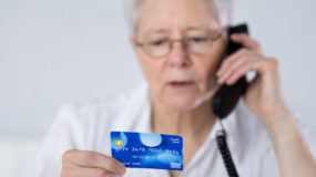 Lady on phone with credit card